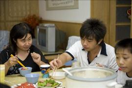 SOS family having dinner, SOS Children's Village Tianjin - photo: Joris Lugtigheid