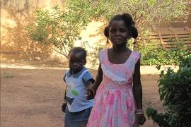 Brother and sister holding hands, SOS Children's Village Ouagadougou - photo: SOS Archives