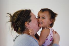 A girl cuddling with her mother - photo: K. Ilievska