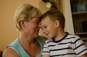A little boy in our care enjoying a special moment with his SOS mother (photo: M. MÃ¤gi)