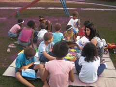Children enjoying reading outside (photo: SOS archives)