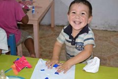 Smiling little boy from our family strengthening programme (photo: SOS archives)