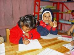 Siblings who are now safe at the social centre while their mother is at work (photo: A. Dominguez)