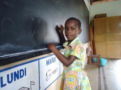 This little girl is able to go to school thanks to SOS Children's Villages (photo: SOS archives)