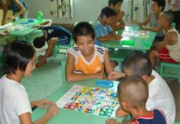 Children playing board games together (photo: SOS archives)