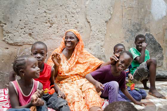 The SOS Family Strengthening Programme helped this single mother of seven set up a vegetable stall in front of her house so that she can make a living and care for her children (photo: C. Ladavicius)