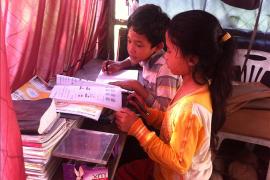 Two children from Battambang doing their homework together (photo: SOS archives)