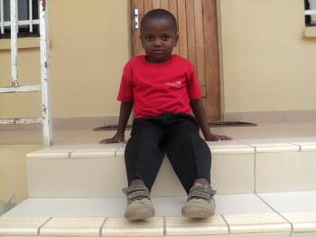 A little boy outside his home in Makeni (photo: SOS archives)