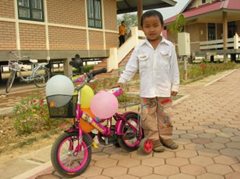 Little boy outside the family homes (photo: SOS archives)