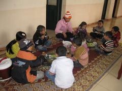 An SOS family sits down together for a meal (photo: SOS archives)