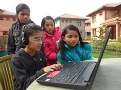 Children learning to use a computer at the children’s village (photo: SOS archives)