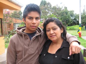 This young man arrived in the village when he was seven years old. Here he poses with his SOS mother, a source of love and support (photo: SOS archives)