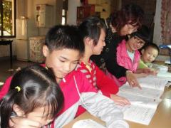 Children receive help with their homework (photo: SOS archives)