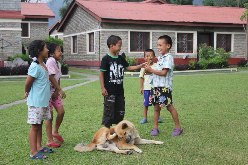 Children playing in the garden of the childrenâs village (photo: SOS archives)