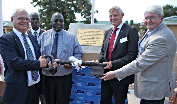 Smart Namagonya [second from left], National Director of SOS Malawi, at the opening of Ngabu Children